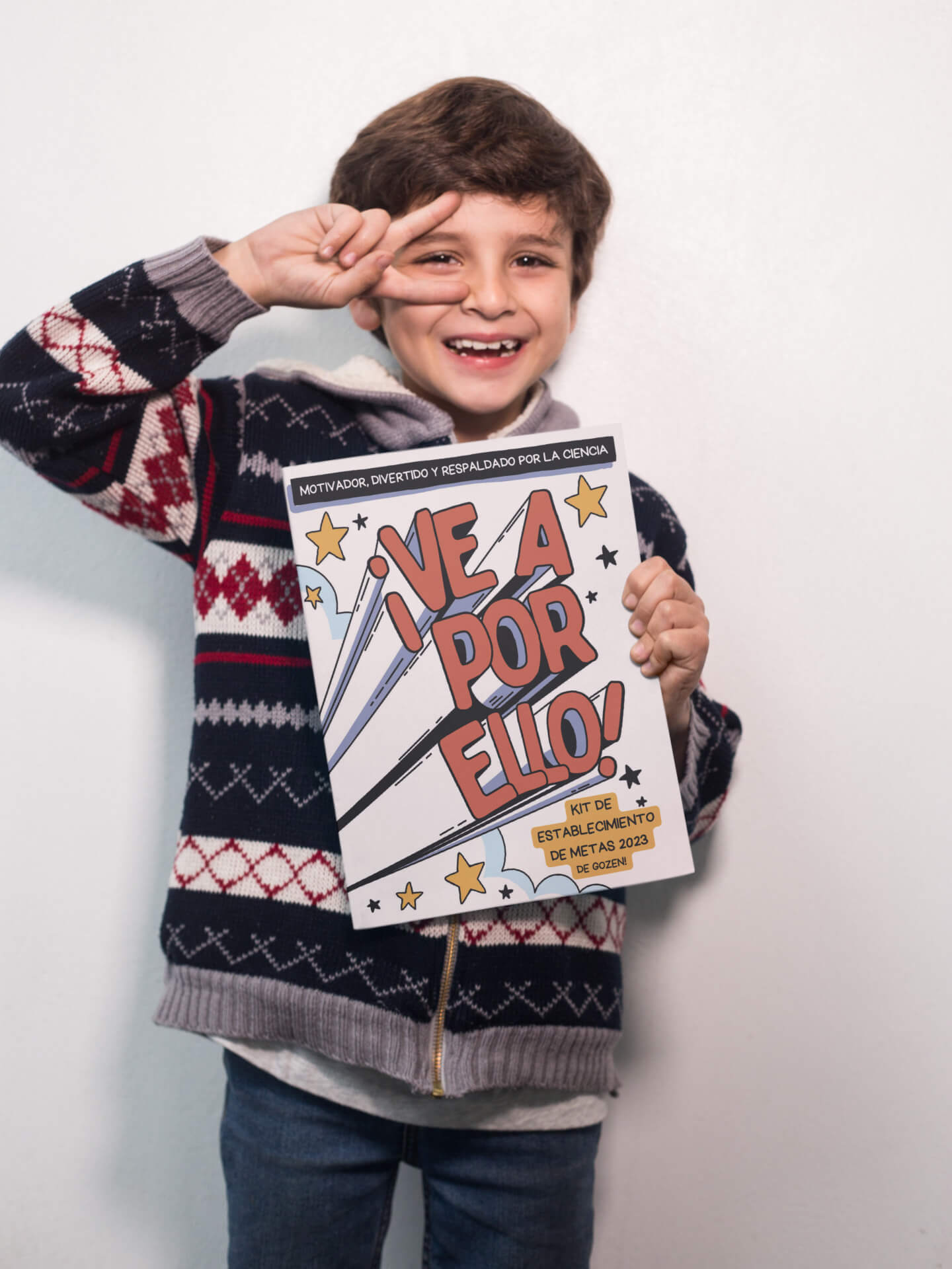 happy-boy-doing-the-peace-sign-holding-a-big-book-mockup-a19220-es